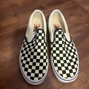 Vans Men’s black and white checkerboard slip on’s